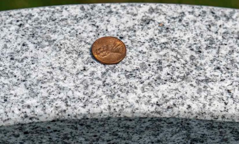 Why Do Some People Place Coins on Gravestones?