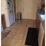 This kitchen is where the big dog is hiding. Can you find it?