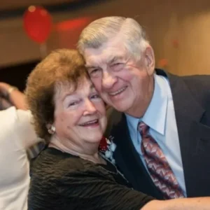 Husband and wife, married for 59 years, greet their 100th grandchild. Four generations together under one roof. Their family photo will astound you.