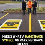 Here’s what a handshake symbol on a parking space means