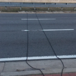 Here’s what those mysterious black cables on the road signify.