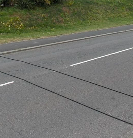 If You Ever See Black Cables Stretching Across The Road, This ls What You Should Do