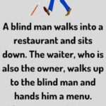 A blind man walks into a restaurant and sits down