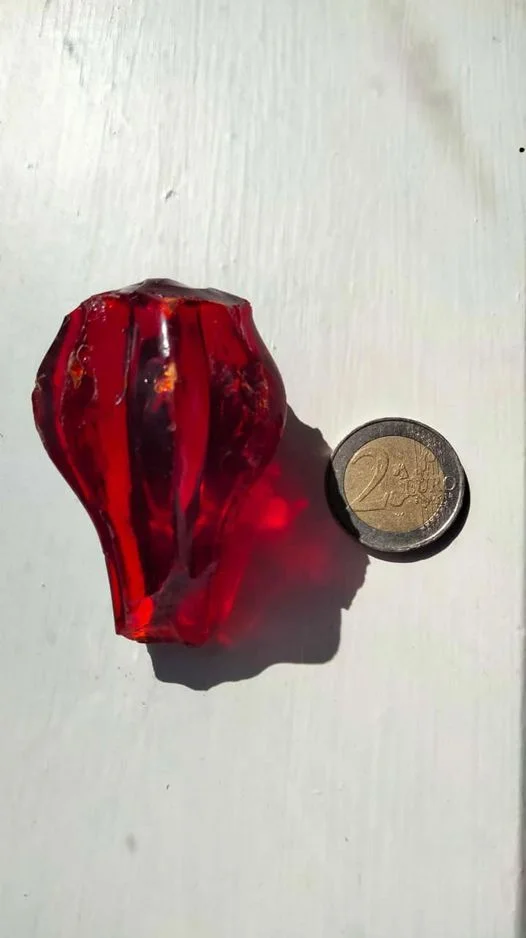 What is this thing? Found in a pile of rubble near my house. Made entirely of solid glass. May not be a complete object because it looks broken on both ends.