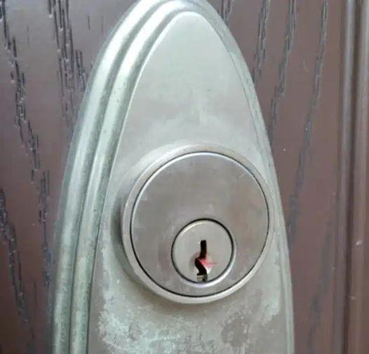 I found red wax in the keyhole on my front door. Any idea ?